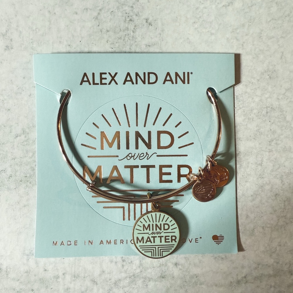 Alex and Ani rose gold bangle.